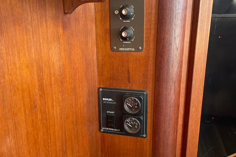 Slide: The Image of Control panel on 1987 Chris-Craft 392 Commander with Kohler generator switches. - 32