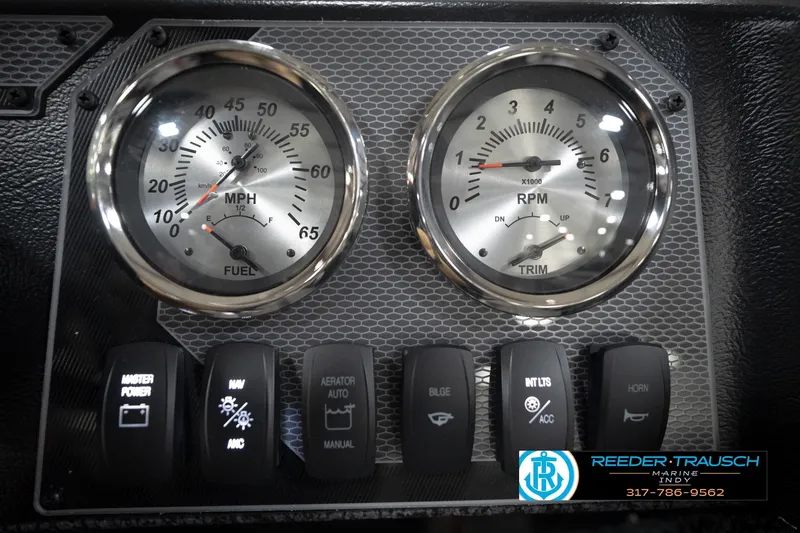Slide: The Image of Dashboard of 2026 Lund 1800 Explorer Sport with gauges and control switches. - 29