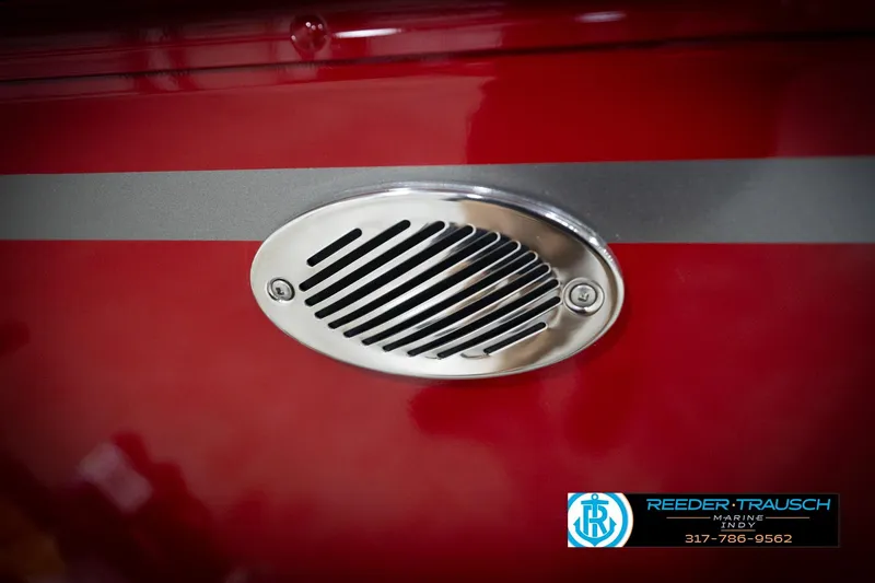Slide: The Image of Red 2026 Lund 1800 Explorer Sport boat with chrome vent detail. - 36