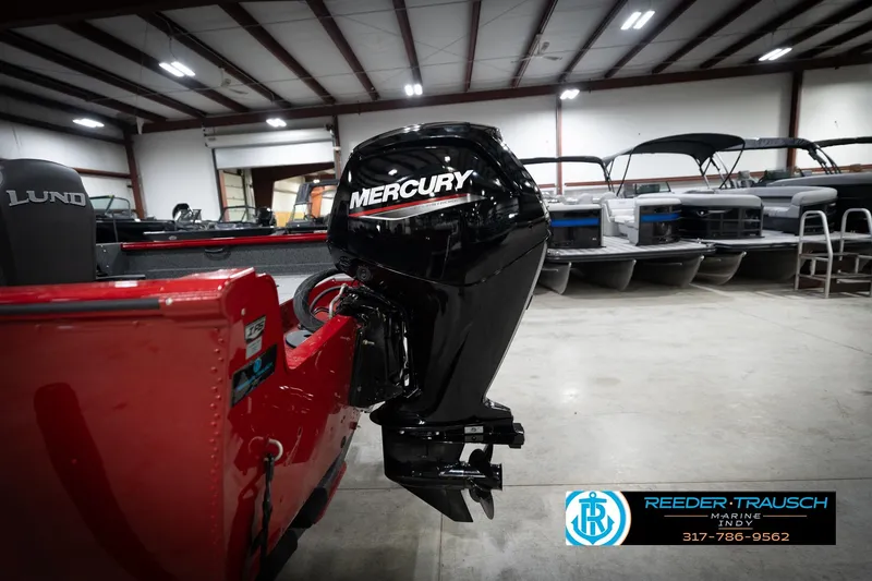 Slide: The Image of 2026 Lund 1800 Explorer Sport with Mercury outboard motor in a showroom. - 40