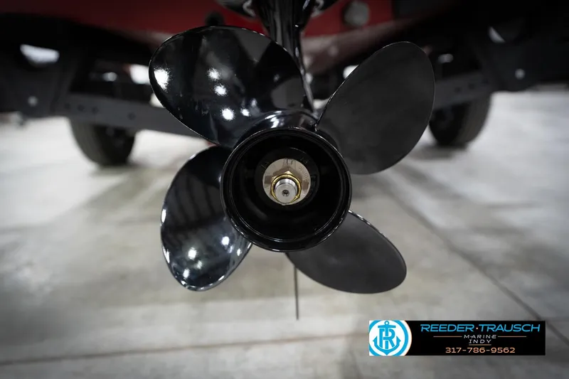Slide: The Image of Close-up of a 2026 Lund 1800 Explorer Sport boat propeller in a showroom. - 44