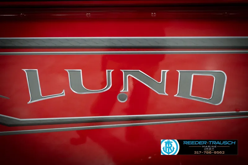 Slide: The Image of Red 2026 Lund 1800 Explorer Sport boat with logo and dealership contact information. - 45