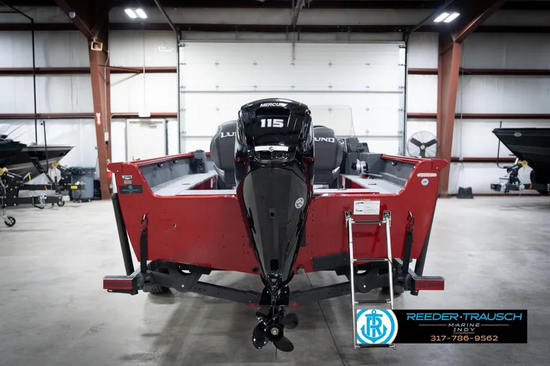 Slide: The Image of 2026 Lund 1800 Explorer Sport boat in a showroom, featuring a powerful Mercury 115 engine. - 8