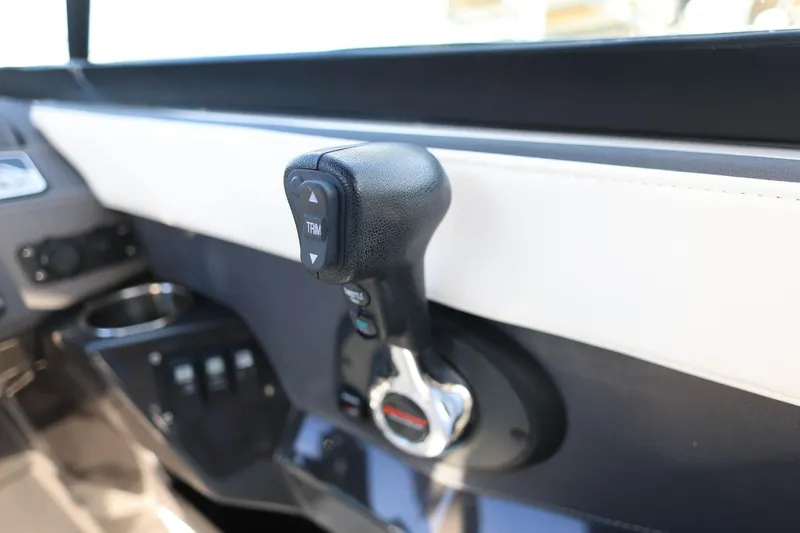 Slide: The Image of Throttle control of 2021 Monterey 275 Super Sport boat, featuring trim adjustment. - 10