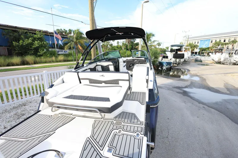 Slide: The Image of 2021 Monterey 275 Super Sport boat with sleek design and spacious deck. - 12