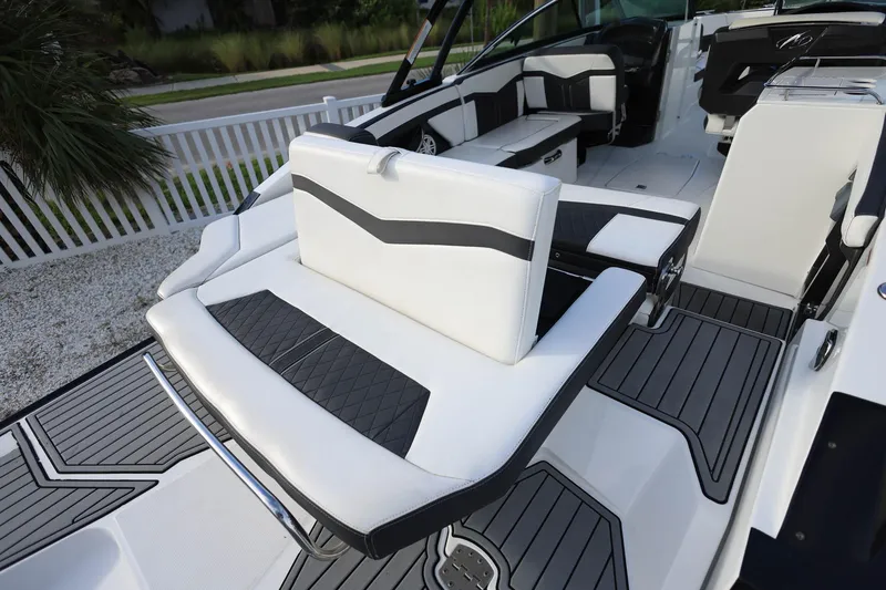 Slide: The Image of 2021 Monterey 275 Super Sport boat interior with sleek white and black seating. - 15