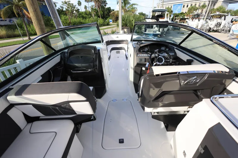 Slide: The Image of Interior view of 2021 Monterey 275 Super Sport boat, featuring sleek seating and modern dashboard. - 16
