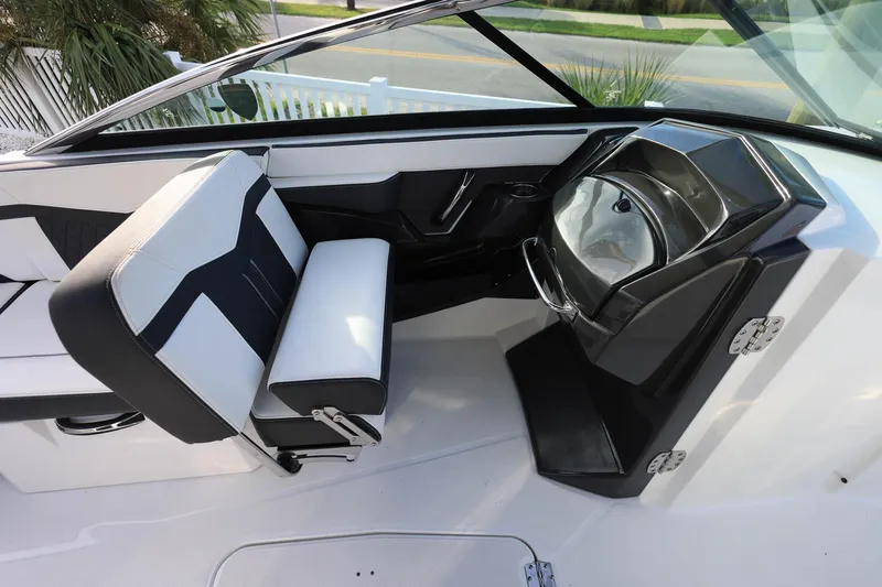 Slide: The Image of 2021 Monterey 275 Super Sport boat interior with sleek seating and modern sink design. - 19