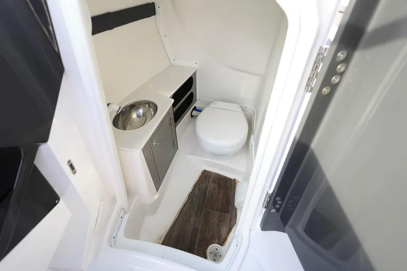 Slide: The Image of 2021 Monterey 275 Super Sport boat bathroom with sink and toilet. - 20