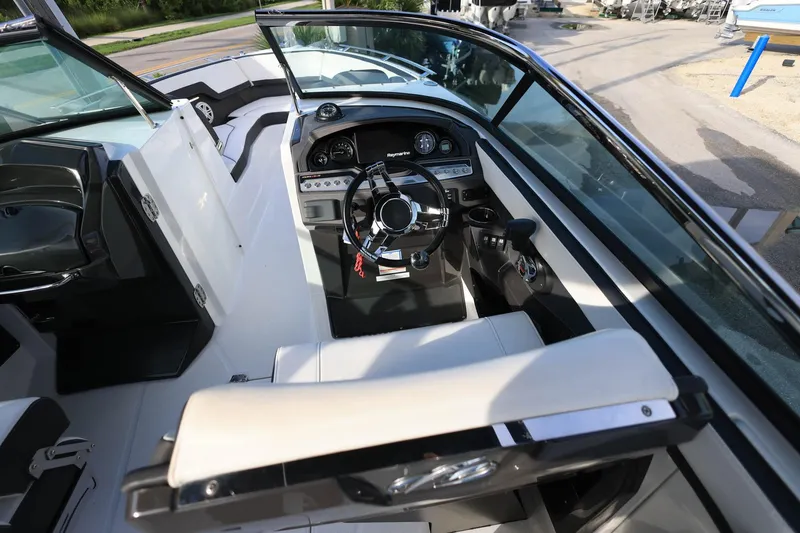Slide: The Image of 2021 Monterey 275 Super Sport boat interior with steering wheel and dashboard controls. - 23