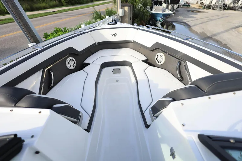 Slide: The Image of Interior of a 2021 Monterey 275 Super Sport boat with sleek seating and speakers. - 26