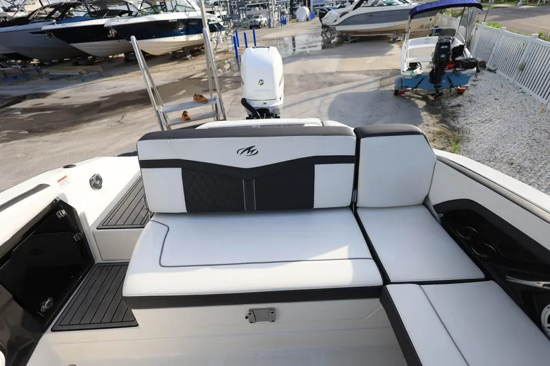 Slide: The Image of 2021 Monterey 275 Super Sport boat interior with white and black seating. - 27