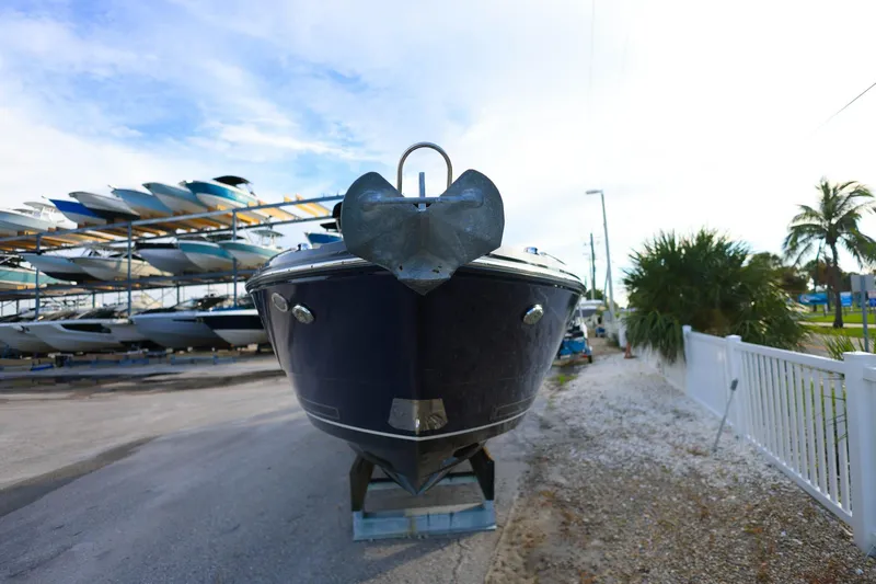 Slide: The Image of 2021 Monterey 275 Super Sport boat on display in a marina setting. - 8