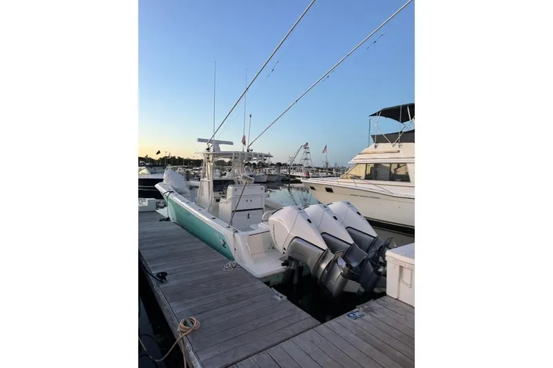 Slide: The Image of 2015 SeaVee 340Z boat docked at marina during sunset. - 5