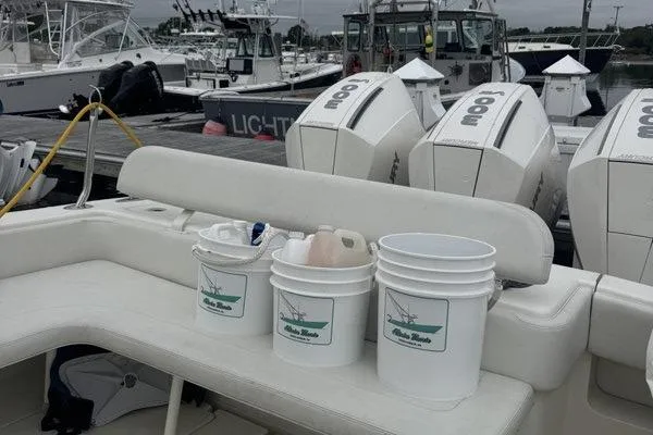 Slide: The Image of 2015 SeaVee 340Z boat with triple outboard engines, docked with fishing gear. - 8