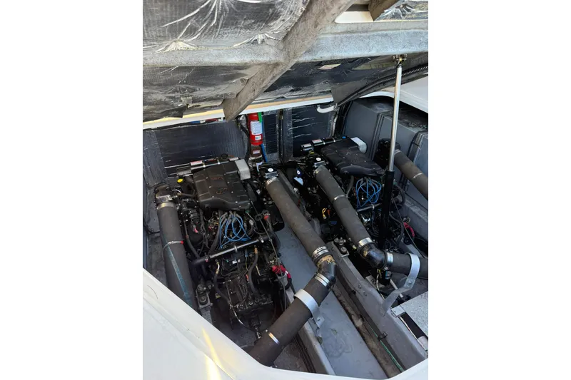 Slide: The Image of Engine compartment of a 2000 Sea Ray 410 Express Cruiser, showcasing dual engines. - 39