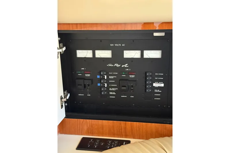 Slide: The Image of Electrical control panel of a 2000 Sea Ray 410 Express Cruiser boat. - 51