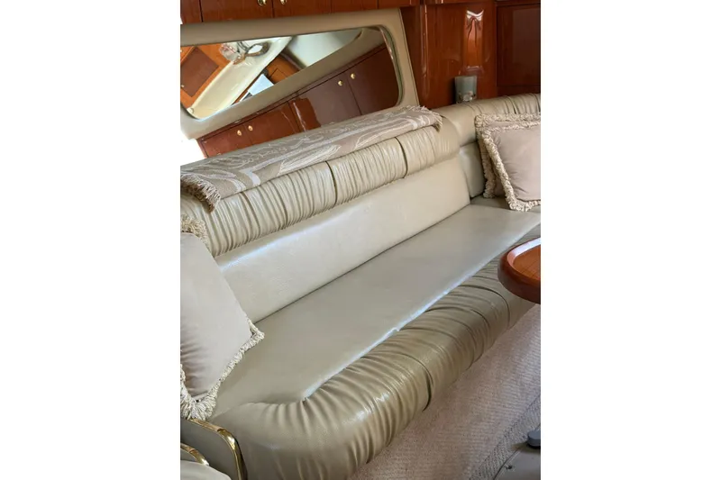 Slide: The Image of Luxurious interior of 2000 Sea Ray 410 Express Cruiser with plush seating and elegant decor. - 56