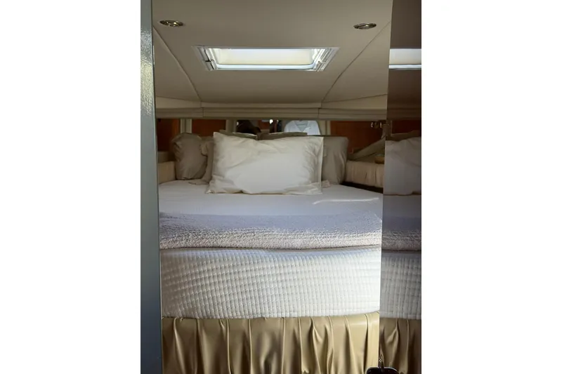 Slide: The Image of Interior cabin of 2000 Sea Ray 410 Express Cruiser with cozy bed and skylight. - 64