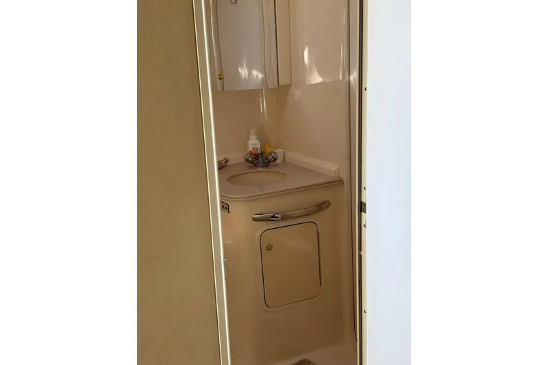 Slide: The Image of Compact bathroom in 2000 Sea Ray 410 Express Cruiser yacht. - 71