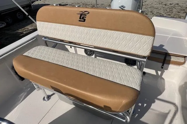 Slide: The Image of 2026 Carolina Skiff 19 LS boat seat with tan and white upholstery, featuring a diamond pattern design. - 4