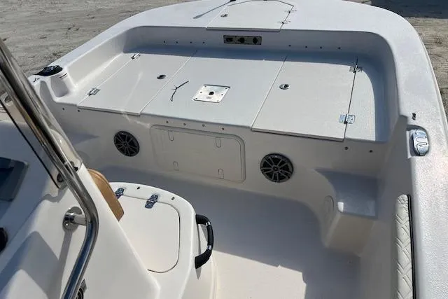Slide: The Image of 2026 Carolina Skiff 19 LS boat interior with storage compartments and speakers. - 7