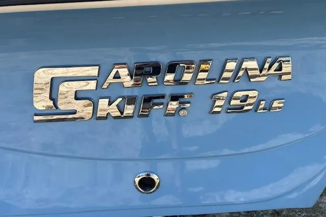 Slide: The Image of 2026 Carolina Skiff 19 LS logo on a blue boat surface. - 9