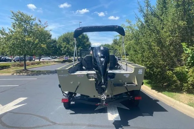 Slide: The Image of 2026 Tracker Targa V-18 Combo boat parked outdoors on a sunny day. - 7