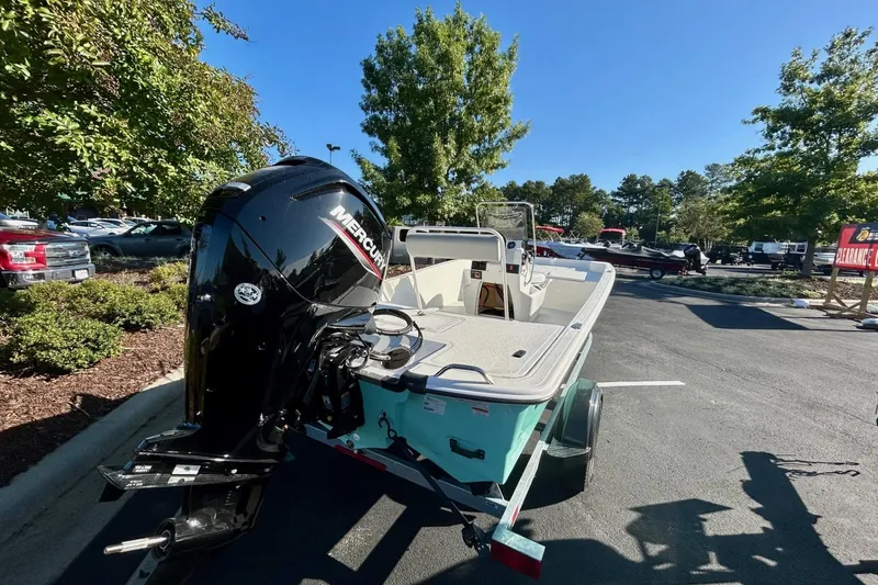 Slide: The Image of 2026 Mako Pro Skiff 17 CC boat on trailer in parking lot. - 4