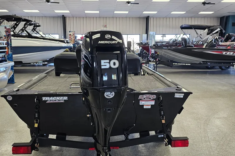 Slide: The Image of 2026 Tracker Bass Tracker Classic XL with Mercury 50 engine in showroom. - 3