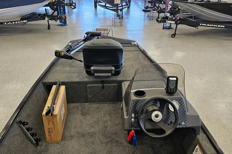 Slide: The Image of 2026 Tracker Bass Tracker Classic XL boat interior with steering console and seating. - 5