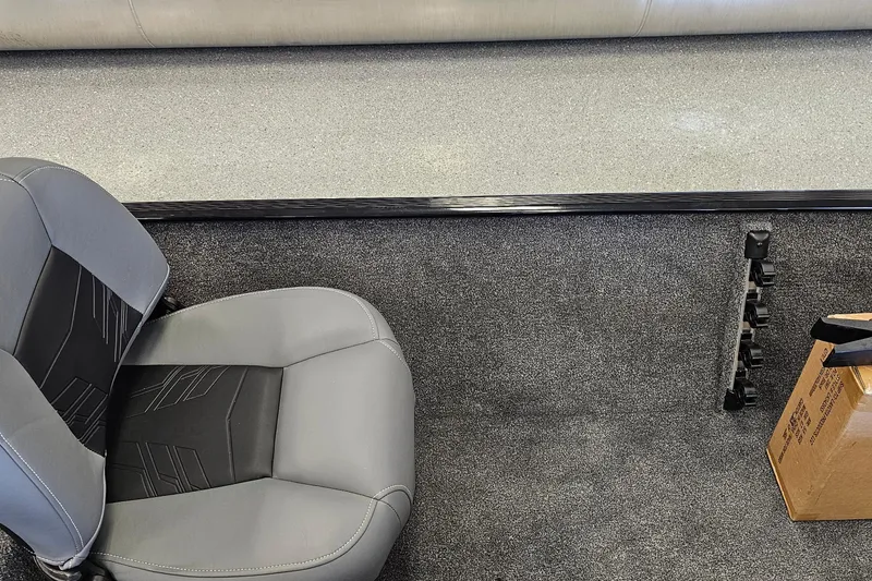 Slide: The Image of 2026 Tracker Bass Tracker Classic XL interior with gray seating and carpeted flooring. - 6