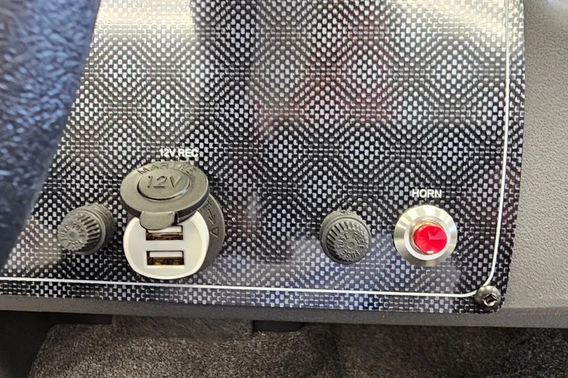 Slide: The Image of Control panel of 2026 Tracker Bass Tracker Classic XL with USB ports and horn button. - 9