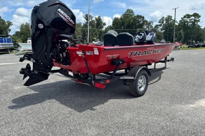 Slide: The Image of 2026 Tracker Pro Team 175 Crappie Edition boat with Mercury engine, parked outdoors. - 5