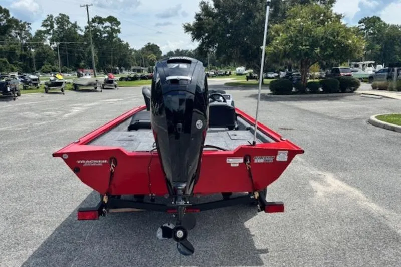 Slide: The Image of 2026 Tracker Pro Team 175 Crappie Edition boat, red, rear view in parking lot. - 6