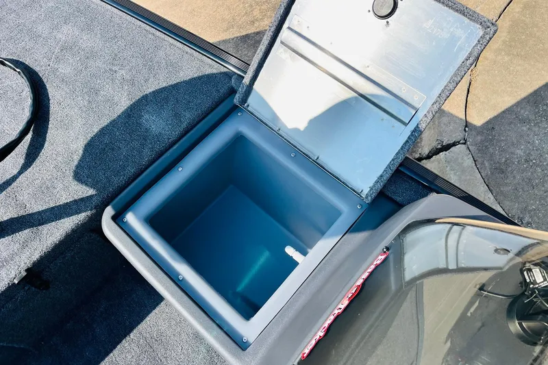 Slide: The Image of Open storage compartment in 2026 Tracker Bass Tracker Classic XL boat. - 11