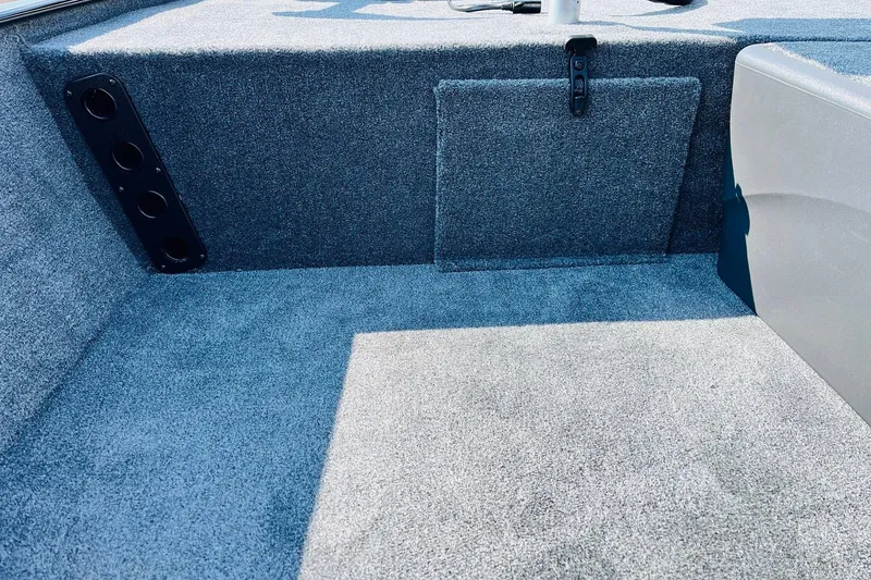 Slide: The Image of Interior of 2026 Tracker Bass Tracker Classic XL boat with carpeted flooring. - 12