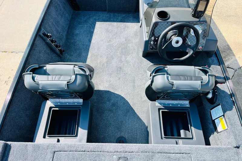 Slide: The Image of 2026 Tracker Bass Tracker Classic XL boat interior with dual seats and steering console. - 18