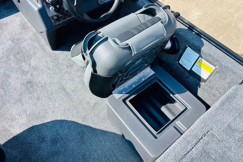 Slide: The Image of 2026 Tracker Bass Tracker Classic XL boat interior with storage compartment and seating. - 20