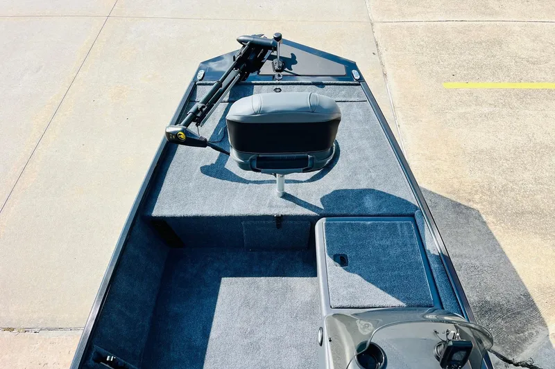Slide: The Image of 2026 Tracker Bass Tracker Classic XL boat interior with seating and control panel. - 8