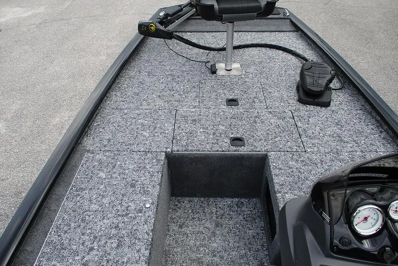 Slide: The Image of 2026 Tracker Pro 170 boat interior with carpeted deck and seating. - 13