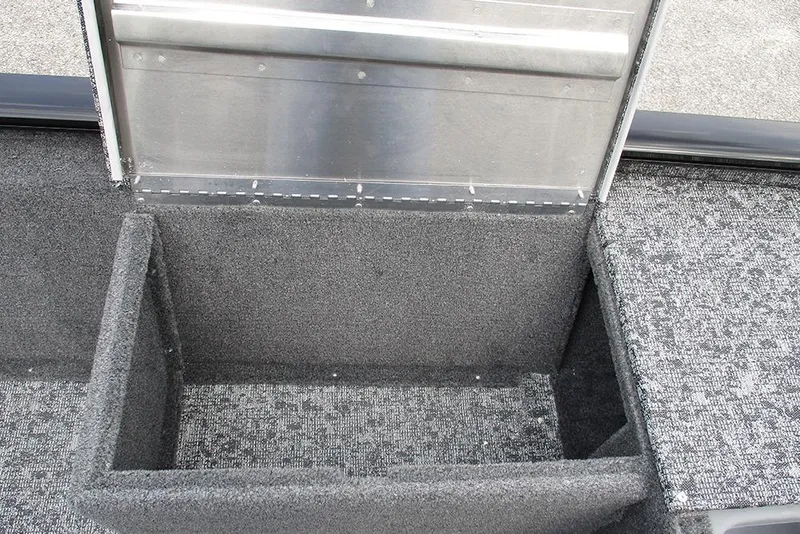 Slide: The Image of Interior storage compartment of 2026 Tracker Pro 170 boat, featuring carpeted finish. - 16