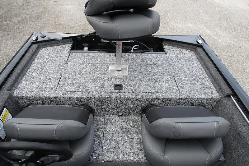 Slide: The Image of 2026 Tracker Pro 170 boat interior with gray seating and carpeted deck. - 17