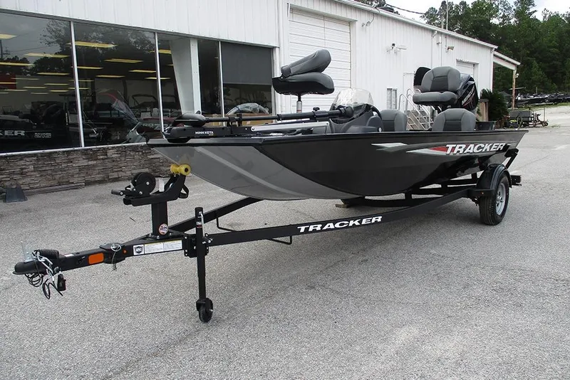 Slide: The Image of 2026 Tracker Pro 170 boat on trailer, parked outside dealership. - 5