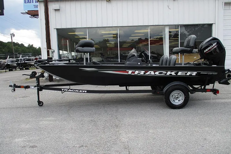 Slide: The Image of 2026 Tracker Pro 170 boat on trailer, parked outside dealership. - 6