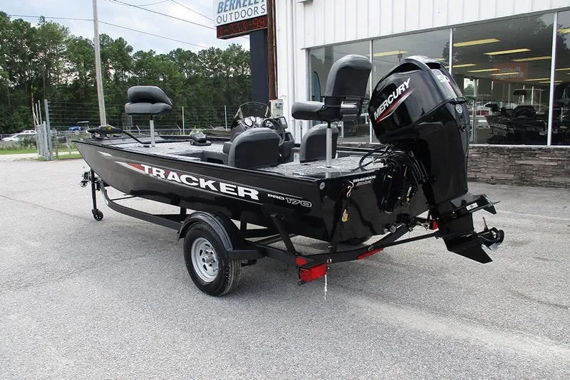 Slide: The Image of 2026 Tracker Pro 170 boat with Mercury engine, parked outside dealership. - 7