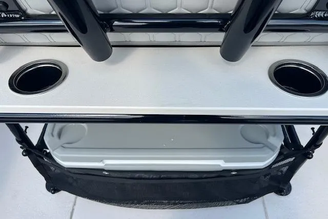 Slide: The Image of 2026 Carolina Skiff 21 Ultra Elite boat console with cup holders and storage compartment. - 3