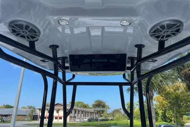 Slide: The Image of 2026 Carolina Skiff 21 Ultra Elite boat interior with speakers and overhead console. - 5