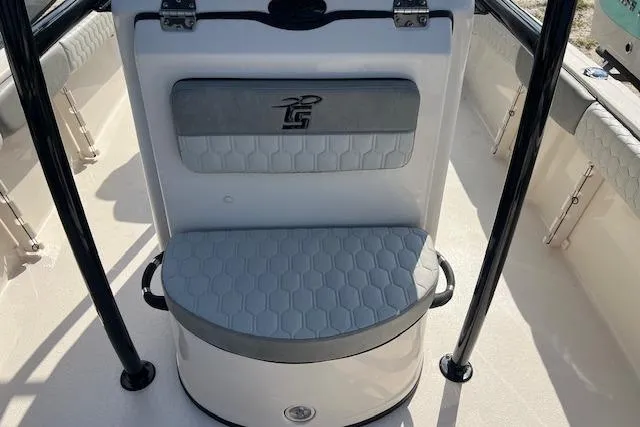 Slide: The Image of 2026 Carolina Skiff 21 Ultra Elite boat seat with gray cushioning and logo detail. - 8
