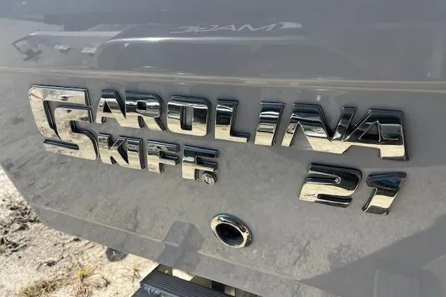Slide: The Image of Carolina Skiff 21 Ultra Elite 2026 logo on boat exterior. - 9